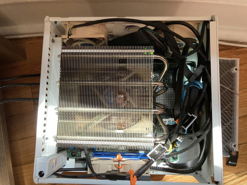 Noctua fans installed on the sides to aid the airflow. The CPU fan exhausts out of the perforated top of the case.